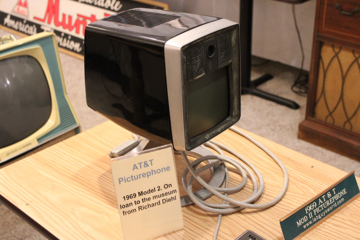An AT&T Picturephone Mod II on a table at the Early Television Museum, beside its handwritten loan card.